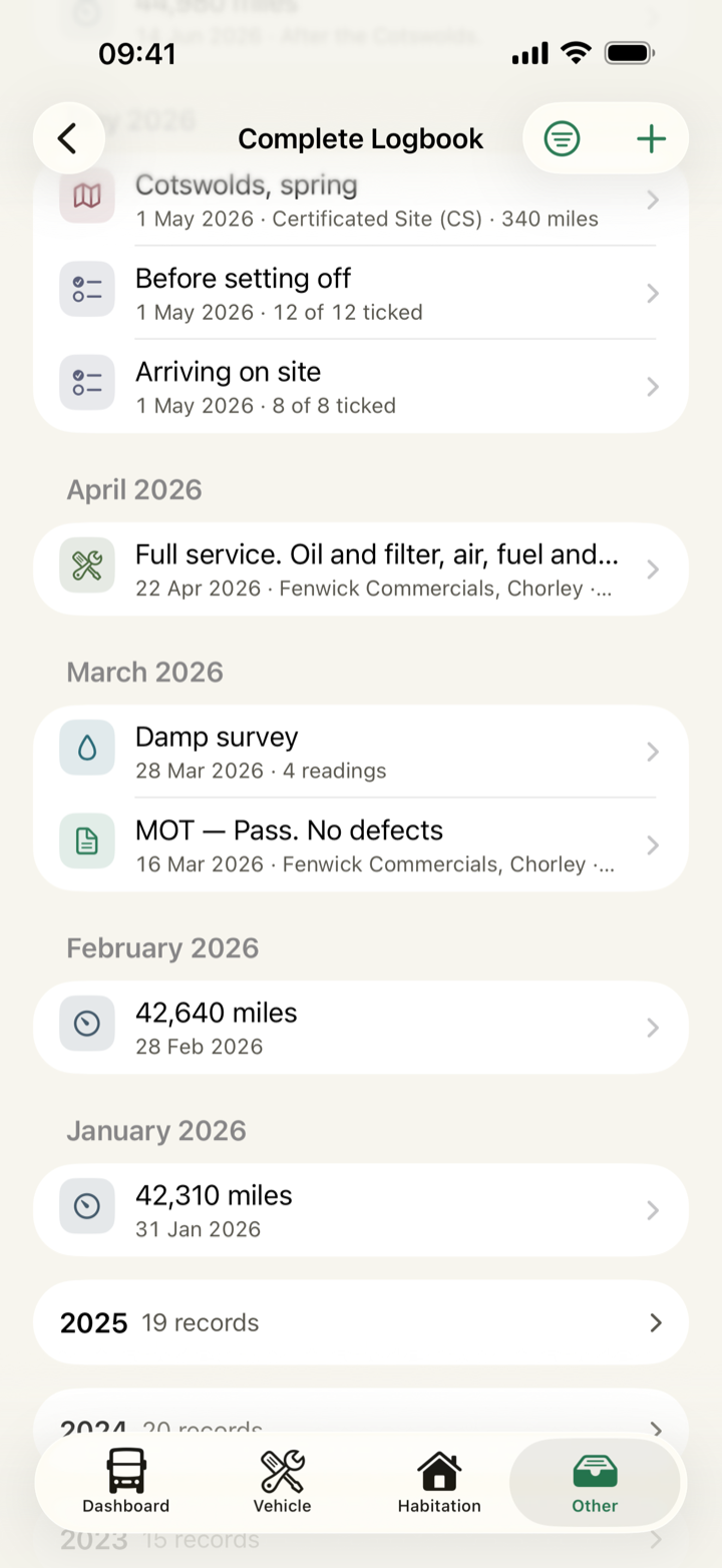 The Complete Logbook: the newest months of services, certificates, damp surveys, tyres, trips and mileage readings in one timeline, and below them each older year as a single row with its record count.